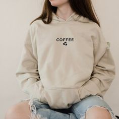 "Description  Coffee Hoodie, Minimalist hoodie, Coffee lover Hoodie, women's unisex coffee hoodie, coffee quote hoodie, I love Coffee, minimalist coffee hoodie   HOW TO ORDER Please, check and review all photos Choose your size from the drop-down menu and add each shirt to your cart one at a time. Click add to cart. You can go back to add more product Click \"Proceed to check out\" When you check out, you can add a note to the seller for any request FABRICATION Classic fit. 271 g/m2 50% Cotton, Coffee Minimalist, I Love Coffe, Minimalist Hoodie, New Mama Gift, Hoodie Minimalist, Cute Zodiac, Coffee Hoodie, Minimalist Coffee, Mama Hoodie