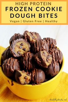 a yellow bowl filled with chocolate covered cookies