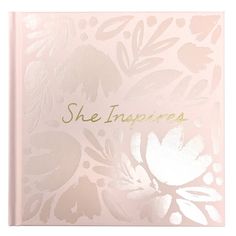 a pink notebook with the words she inspires written on it in gold foiling