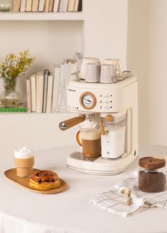 an espresso machine sitting on top of a table