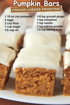 pumpkin bars with cream cheese frosting on a white plate