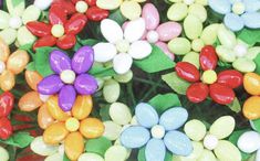 colorful candies are arranged on top of each other in the shape of flower petals