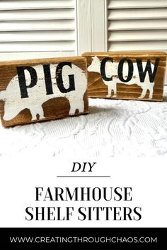 two wooden signs that say pig cow and farm house shelf sitters on a bed