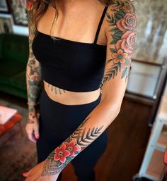 a woman with tattoos on her arms and arm