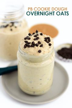 a cookie dough overnight oats in a jar with chocolate chips on top and spoon next to it