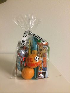 a plastic bag filled with assorted items sitting on top of a white countertop