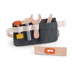 a wooden tool holder with tools in it and an orange handle on the back pocket