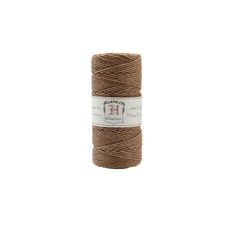 a spool of brown twine on a white background