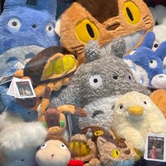 many stuffed animals are on display for sale