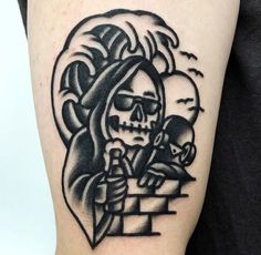 a black and white tattoo with a skeleton holding a knife