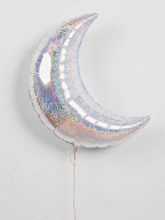 a balloon shaped like the moon hanging from a string