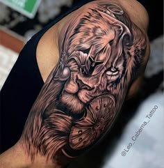 a man's arm with a lion tattoo on it, and an arrow in the middle