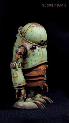 an old, rusty robot is posed on a black background with the caption romax194