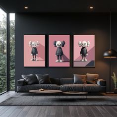 two paintings are hanging on the wall next to a couch