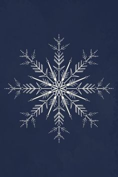 a white snowflake on a dark blue background