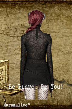 a woman with red hair is standing in front of a wooden box and writing on the wall