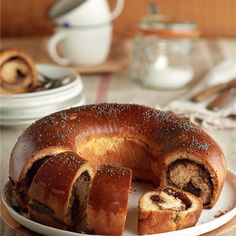 a bundt cake on a plate with one slice cut out