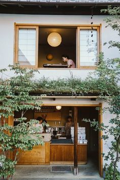 the outside of a building with plants growing on it