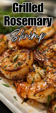 grilled rosemary shrimp on a white plate with text overlay that reads grilled rosemary shrimp