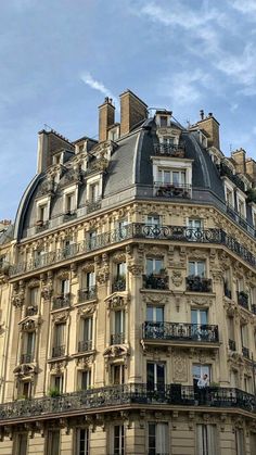 an old building with balconies and balconyes on the top floor in paris