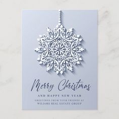 a merry christmas card with an ornament on the front and bottom, in silver