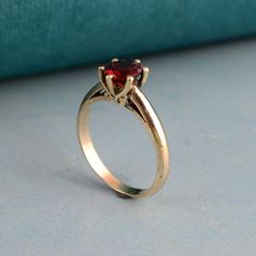 Garnet Solitaire Ring, Diamond Cut Ring, Red Garnet Handmade Ring, Minimalist Ring, Gold Filled Garnet Ring, Gift For Her, Wedding Gift Ring Welcome to My shop We provide the Excellent quality Jewelry to our Customers. Customer satisfaction is our first priority Handmade Items PRODUCT:- Ring Material:- Brass ♥ We have brass and 925 sterling silver rings in all size for both men and women. ♥ We always use precious and semi precious gemstone for making jewelry.If you have any design in your mind s Classic Red Birthstone Stackable Rings, Dainty Red Solitaire Ruby Ring, Dainty Red Solitaire Birthstone Ring, Classic Red Ruby Stackable Rings, Red Birthstone Promise Ring With Round Band, Red Dainty Birthstone Ring With Prong Setting, Dainty Red Birthstone Ring With Prong Setting, Classic Red Birthstone Ring, Red Open Ring Jewelry For Wedding