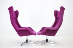 two purple chairs sitting next to each other on top of a white floor covered in carpet