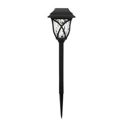 a black post light with an intricate design on the top and bottom, against a white background