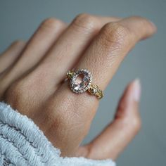 a woman's hand with a ring on it