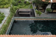 an aerial view of a small backyard with a pool