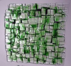 a painting made out of green glass blocks