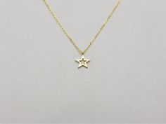 Star Necklace / Gold Star Necklace / 14k Gold Star Necklace / Star Charm Necklace / Solid Gold Star Necklace   Free Shipping   within the USA Handmade beautiful 14k solid gold Star necklace.  Dainty and delicate star necklace perfect for everyday wear. the star is 14k solid gold with a diamond cut cable link chain with a sturdy lobster lock.  please specify the color gold and length when ordering. if you dont see an option that you would like , please let me know.  i will do my best to accomodat Gold Star Necklace, Necklace Star, Star Necklace Gold, Star Charm Necklace, Rose Gold Chain, Necklace Dainty, Gold Star, Star Charms, Necklace Sizes