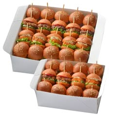 two boxes filled with mini hamburgers on toothpicks