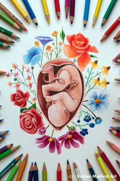 colored pencils surround a drawing of a mother and baby in a heart surrounded by flowers