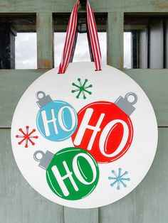 a christmas ornament hanging from the side of a door