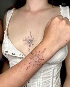 a woman's arm with a star tattoo on the left side of her arm