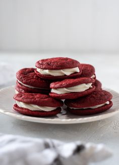 red velvet cookies with white frosting on a plate, ready to be eaten for breakfast