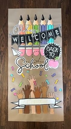 a welcome back to school poster with crayons