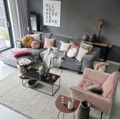 a living room filled with lots of furniture next to a large glass door window and a rug on the floor