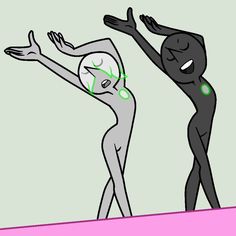 two people standing on top of a pink and green surface with their hands in the air