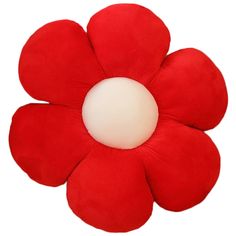 a red flower shaped pillow with a white center