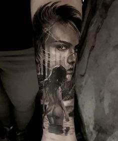 a man's arm with an image of a woman on it and the words, i