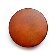 a round wooden object on a white background