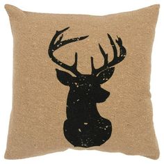 a deer head on a burlocked pillow with black ink painted on it