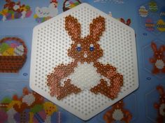 a close up of a cross stitch bunny