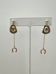 Lasso up with these fun cowboy hat and horseshoe drop/back earrings. All made with 14k gold fill. Super lightweight. Total length is a little over 2 inches. Tarnish resistant Safe for sensitive skin. Western Style Dangle Earrings For Pierced Ears, Adjustable Gold Horseshoe Jewelry, Cowboy Jewelry, Anklet Bracelet, Wrap Rings, Cowboy Hat, Earring Necklace, Ring Necklace, Charm Jewelry