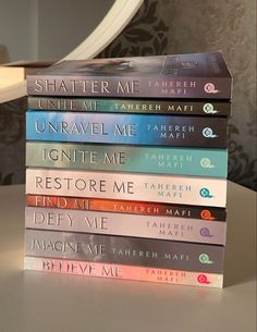 a stack of books sitting on top of a table