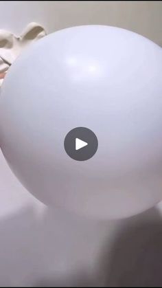 a large white balloon sitting on top of a table