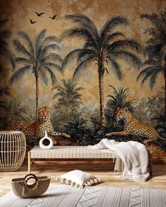 two cheetah sitting on a bench in front of a wall with palm trees