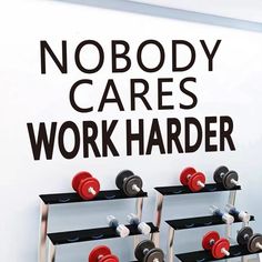 there is a sign that says nobody cares work harder and dumbs are on the rack